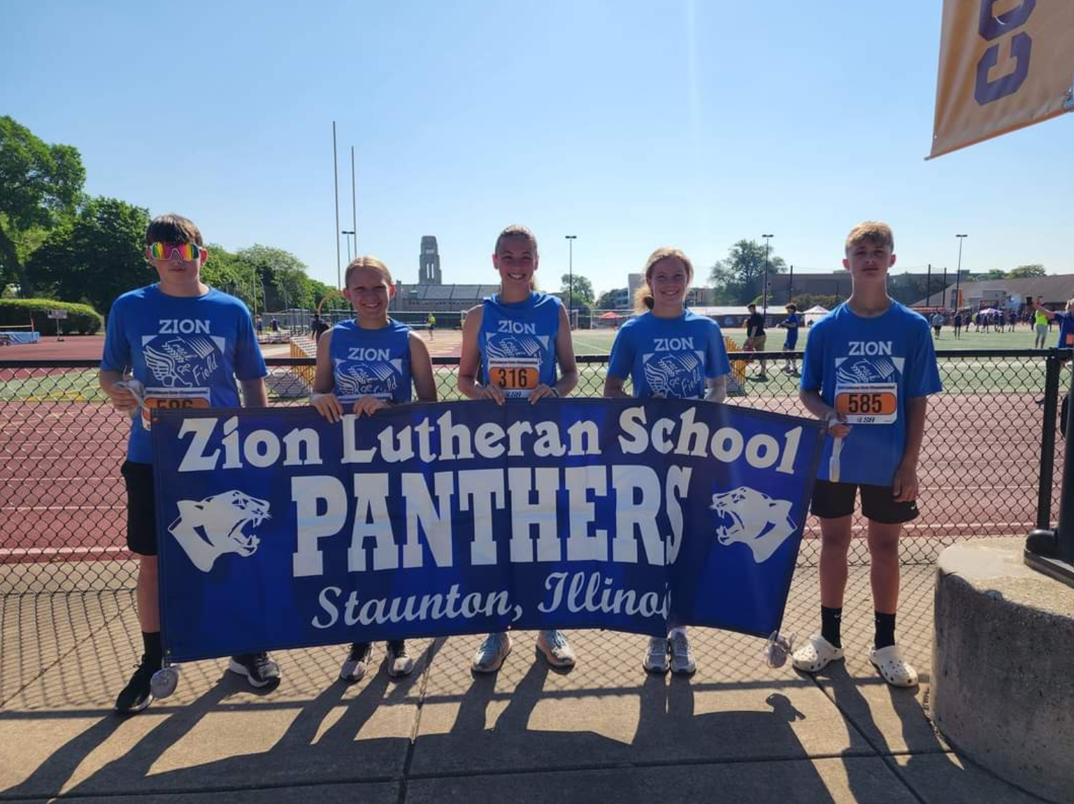 Extra Curricular a child is drawing on a piece of paper