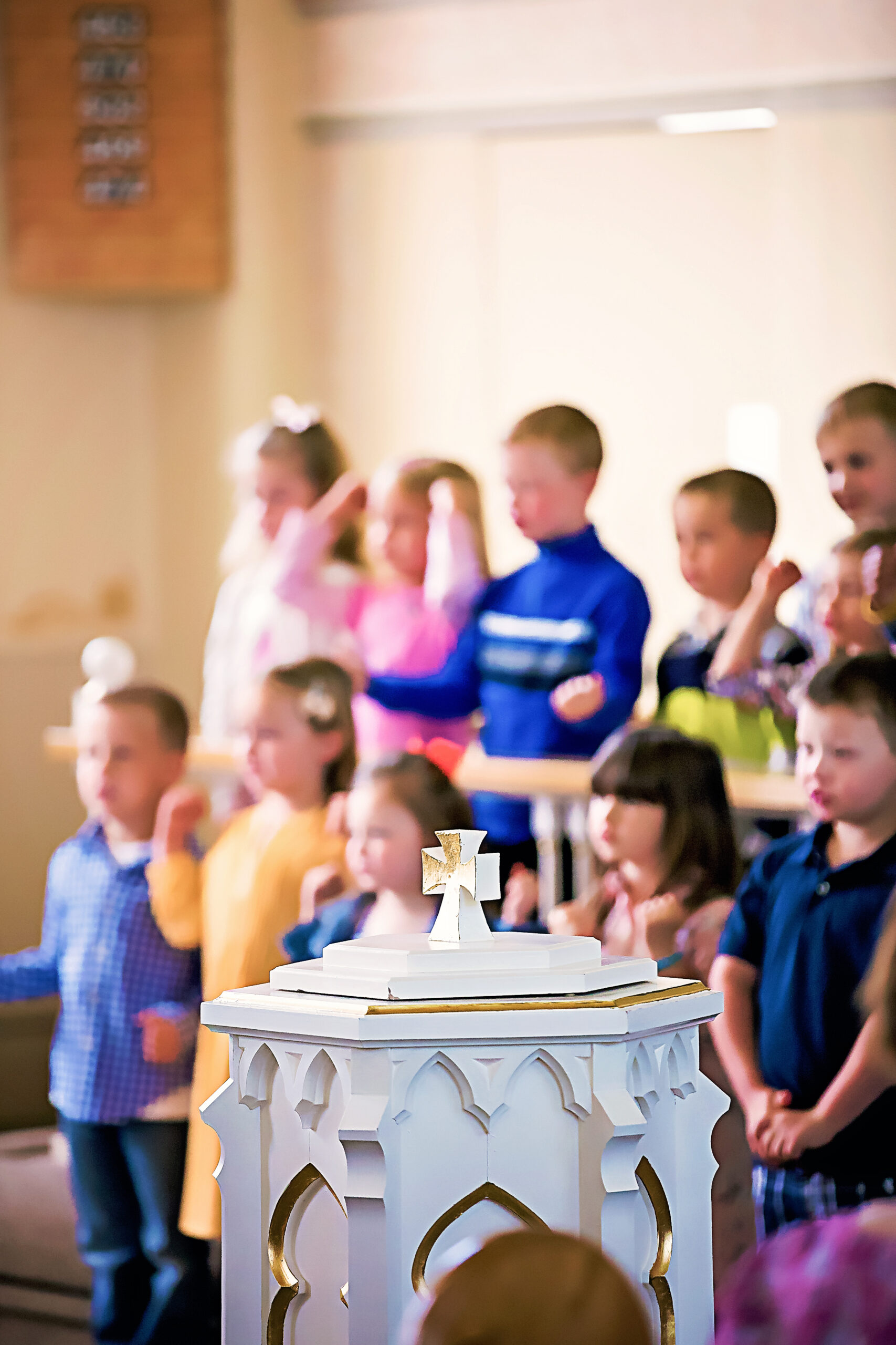 Zion Lutheran ELC people sitting on chair in front of table while holding pens during daytime